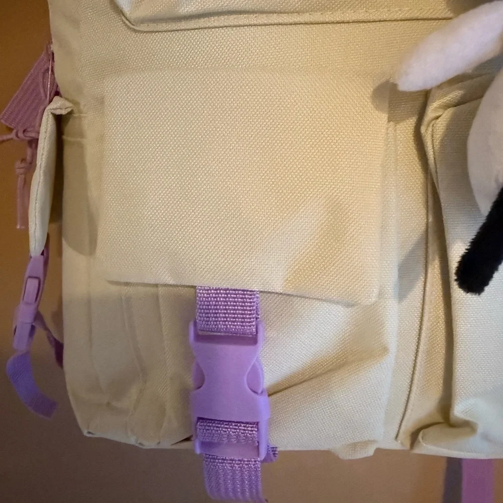Cream Backpack with Purple Accents and Plush Keychain